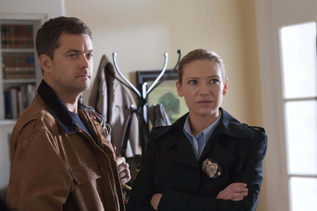 FRINGE: Peter (Josh Jackson, L) and Olivia (Anna Torv, R) search a suspect's house in the "And Those We've Left Behind" episode of Fringe airing Friday, Nov. 11 (9:00-10:00 PM ET/PT) on FOX. ©2011 Fox Broadcasting Co. CR: Liane Hentscher/FOX
