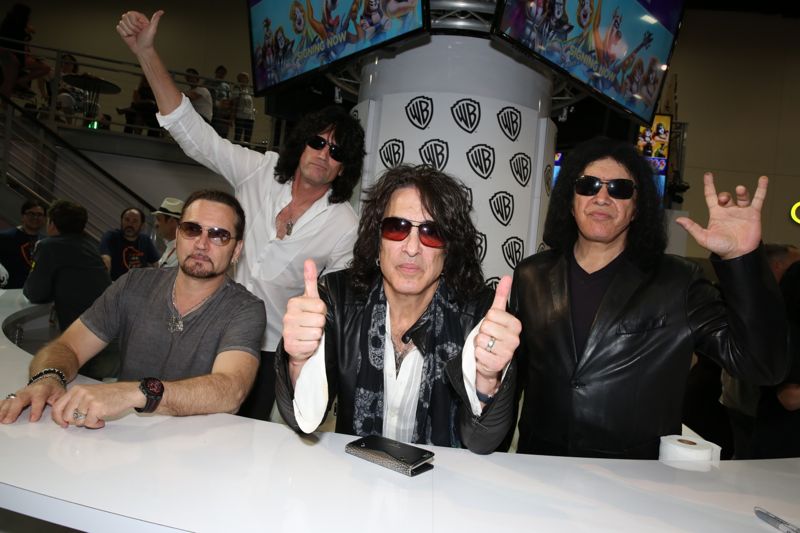 (L-R) KISS members Eric Singer, Tommy Thayer, Paul Stanley and Gene Simmons preside over their SCOOBY-DOO! AND KISS: ROCK AND ROLL MYSTERY signing in the Warner Bros. booth at Comic-Con 2015. #WBSDCC (©2015 WBEI. All rights reserved.)