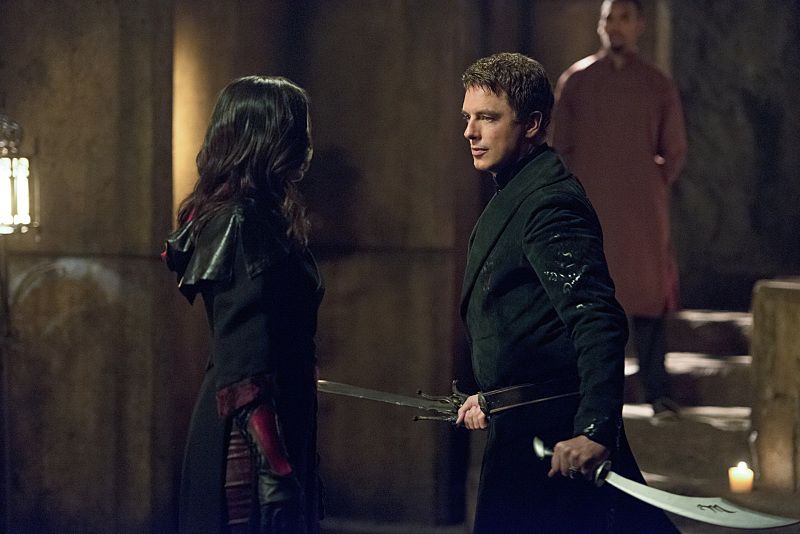 Arrow -- "Restoration" -- Image AR403B_0071b.jpg -- Pictured (L-R): Katrina Law as Nyssa al Ghul and John Barrowman as Malcolm Merlyn -- Photo: Diyah Pera /The CW -- é 2015 The CW Network, LLC. All Rights Reserved.