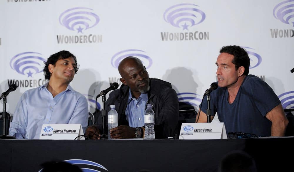 FOX FANFARE AT WONDERCON® LOS ANGELES 2016: L-R: WAYWARD PINES Executive Producer M. Night Shyamalan and cast members Jason Patrick and Djimon Hounsou speak to fans during the WAYWARD PINES panel at WonderCon® Los Angeles 2016 on Saturday, March 26 at the FOX FANFARE AT WONDERCON® LOS ANGELES 2016 at the Los Angeles Convention Center in Los Angeles, CA. CR: Frank Micelotta/FOX © 2016 FOX BROADCASTING