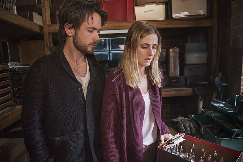 "Arrangement in Grey and Black" - A prominent Boston family reels in the wake of the chilling discovery that someone in their midst is linked to an infamous string of murders, on the series premiere of "American Gothic," Tuesday, June 22 (10:00-11:00PM, ET/PT), on the CBS Television Network. Juliet Rylance, Antony Starr, Virginia Madsen, Justin Chatwin, Megan Ketch, Elliot Knight, Stephanie Leonidas and Gabriel Bateman star. Pictured: Cam Hawthorne (Justin Chatwin) and Tessa (Megan Ketch) find a box of Silver bells. Photo: Christos Kalohoridis/CBS é2016 CBS Broadcasting, Inc. All Rights Reserved.