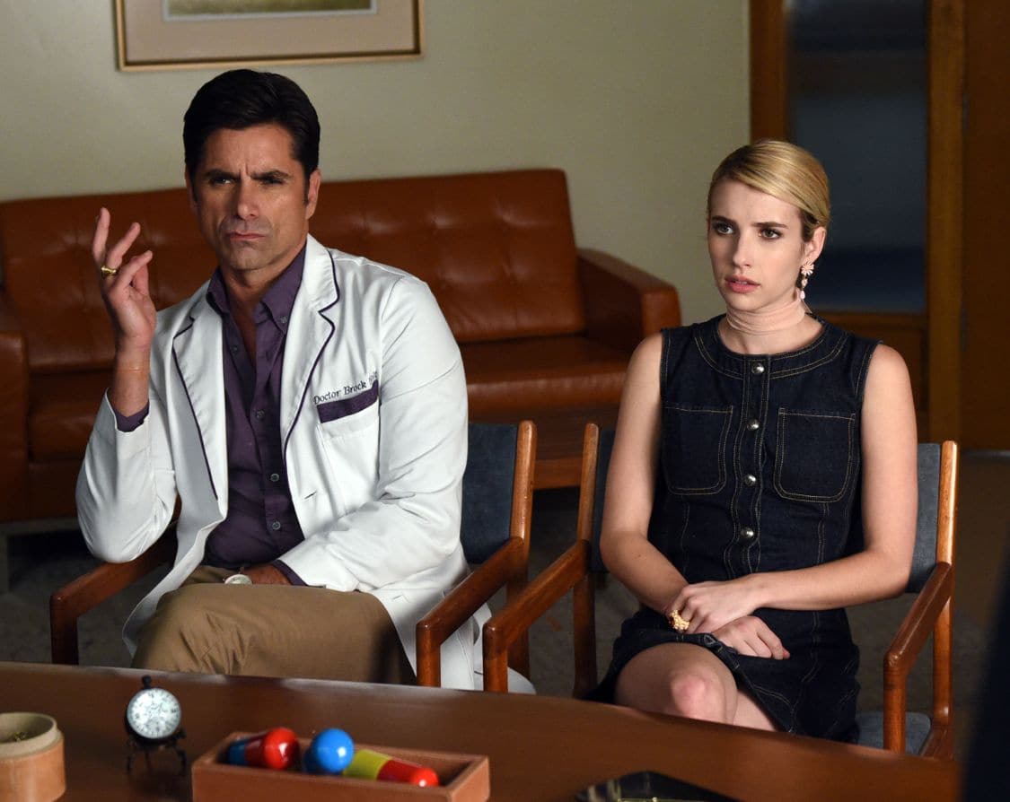 SCREAM QUEENS: L-R: John Stamos and Rebecca Roberts in the all-new “Handidates” episode of SCREAM QUEENS airing Tuesday, Oct. 11 (9:01-10:00 PM ET/PT) on FOX. Cr: Michael Becker / FOX. © 2016 FOX Broadcasting Co.