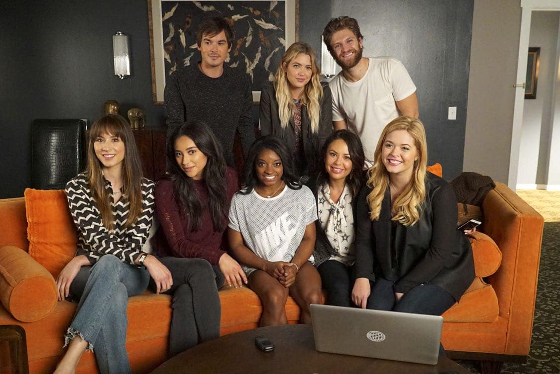 PRETTY LITTLE LIARS - USA Olympic gold medal gymnast Simone Biles visits the set of 'Pretty Little Liars.'" (Freeform/Byron Cohen) BACK ROW: TYLER BLACKBURN, ASHLEY BENSON, KEEGAN ALLEN; FRONT ROW: TROIAN BELLISARIO, SHAY MITCHELL, SIMONE BILES, JANEL PARRISH, SASHA PIETERSE