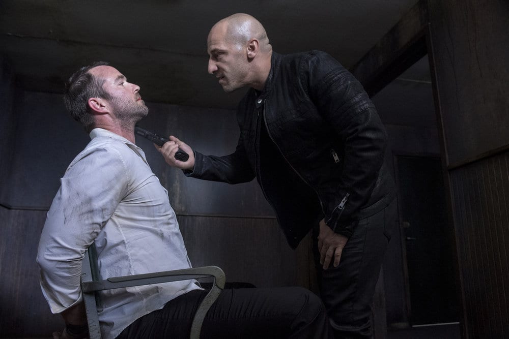 BLINDSPOT -- "Do Not Slack, the Featherweight Wins" Episode 208 -- Pictured: (l-r) Sullivan Stapleton as Kurt Weller, Dale Pavinski as Pavel -- (Photo by: David Giesbrecht/Warner Bros/NBC)