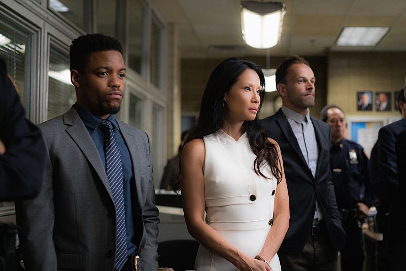 "Henny Penny the Sky is Falling" -- Captain Gregson lobbies to include Holmes and Watson when his unit is selected to receive a city commendation for its exemplary work. Also, as Holmes and Watson consult on the investigation into a financial analyst's murder, they are drawn into the world of asteroid research, on the 100th episode of ELEMENTARY, Sunday, Oct. 30 (10:00-11:00 PM, ET/PT) on the CBS Television Network. Pictured (L-R) Jon Michael Hill as Detective Marcus Bell, Lucy Liu as Joan Watson and Jonny Lee Miller as Sherlock Holmes Photo: Michael Parmelee/CBS é2016 CBS Broadcasting, Inc. All Rights Reserved