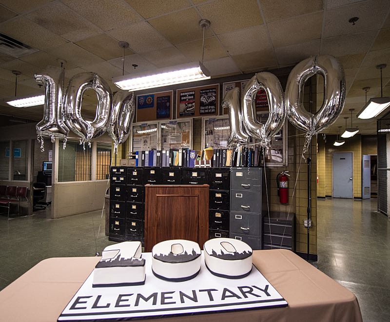 "Henny Penny The Sky Is Falling" -- The cast of ELEMENTARY celebrates their milestone 100th episode with a cake-cutting ceremony Pictured (L-R) Photo: Michele Crowe /CBS é2016 CBS Broadcasting Inc. All Rights Reserved.