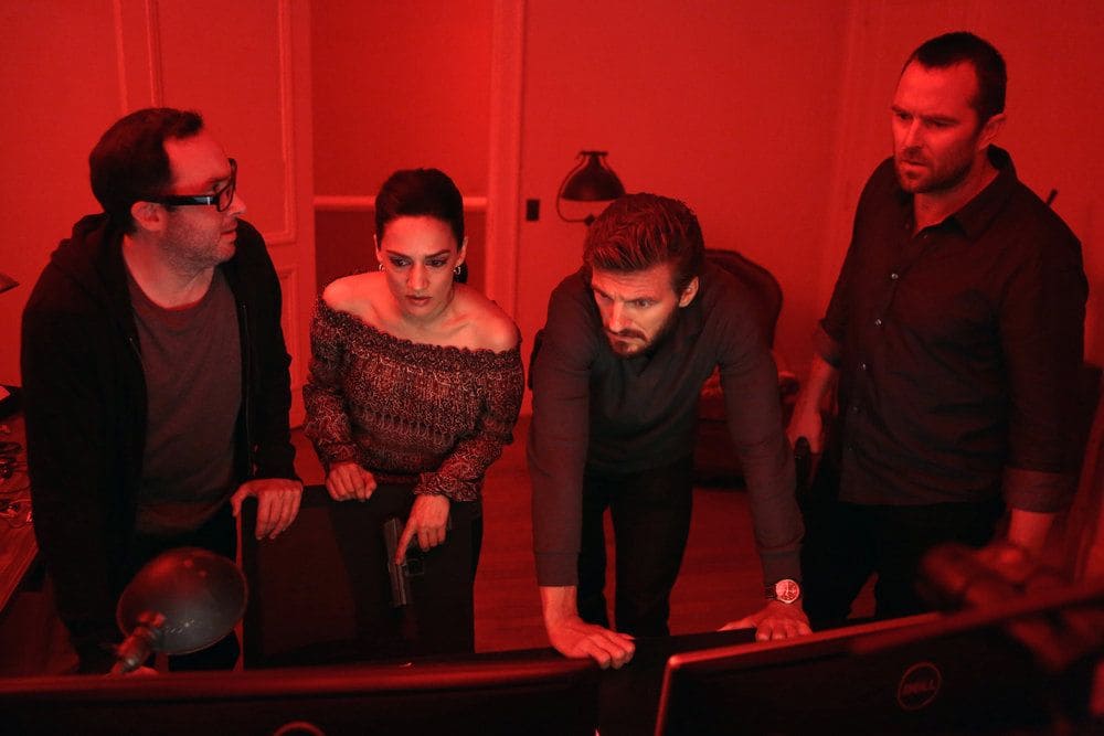BLINDSPOT-- Her Spys Mind Episode 206 -- Pictured: (l-r) P.J. Byrne as Douglas Winter, Archie Panjabi as Nas Kamal, William Connell as Mike Caruso, Sullivan Stapleton as Kurt Weller -- (Photo by: Giovanni Ruffino/NBC)