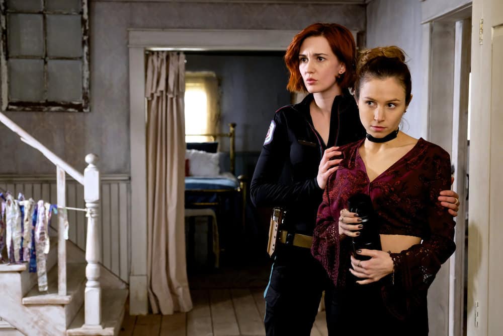 WYNONNA EARP -- "Whiskey Lullaby" Episode 206 -- Pictured: (l-r) Katherine Barrell as Officer Nicole Haught, Domonique Provost-Chalkley as Waverly Earp -- (Photo by: Michelle Faye/Syfy/Wynonna Earp Season 2) WYNONNA EARP -- "Whiskey Lullaby" Episode 206 -- Pictured: (l-r) Katherine Barrell as Officer Nicole Haught, Domonique Provost-Chalkley as Waverly Earp -- (Photo by: Michelle Faye/Syfy/Wynonna Earp Season 2)