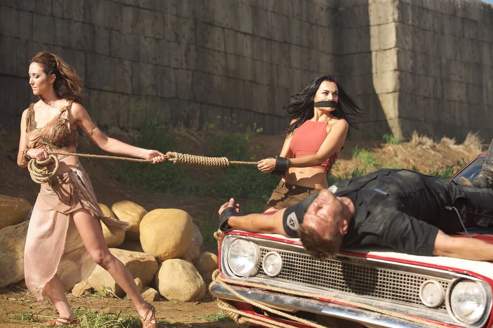 BLOOD DRIVE -- "Booby Traps" Episode 106 -- Pictured: (l-r) Alan Ritchson as Arthur, Christina Ochoa as Grace BLOOD DRIVE -- "Booby Traps" Episode 106 -- Pictured: (l-r) Alan Ritchson as Arthur, Christina Ochoa as Grace