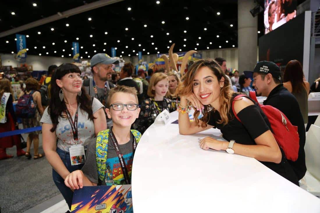 UNIKITTY! art director Andrea Fernandez shares a moment with an enthused young fan at the Warner Bros. booth at Comic-Con 2017 on Thursday, July 20. #WBSDCC (© 2017 WBEI. All Rights Reserved) UNIKITTY! art director Andrea Fernandez shares a moment with an enthused young fan at the Warner Bros. booth at Comic-Con 2017 on Thursday, July 20. #WBSDCC (© 2017 WBEI. All Rights Reserved)