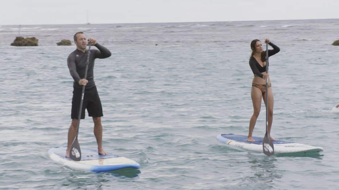 "O ka mea ua hala, ua hala ia."-- When a man accused of killing his wife threatens to commit suicide, Grover reveals how he too was once on the brink of taking his own life, on HAWAII FIVE-0, Friday, Jan. 12 (9:00-10:00 PM, ET/PT) on the CBS Television Network. Chi McBride appears in a PSA for the National Suicide Prevention Lifeline at the end of the episode. Pictured left to right: Alex O'Loughlin as Steve McGarrett and Meaghan Rath as Tani Rey. Photo credit: Screengrab/é2017 CBS Broadcasting, Inc. All Rights Reserved. ("O ka mea ua hala, ua hala ia." is Hawaiian for "What is Gone is Gone.")