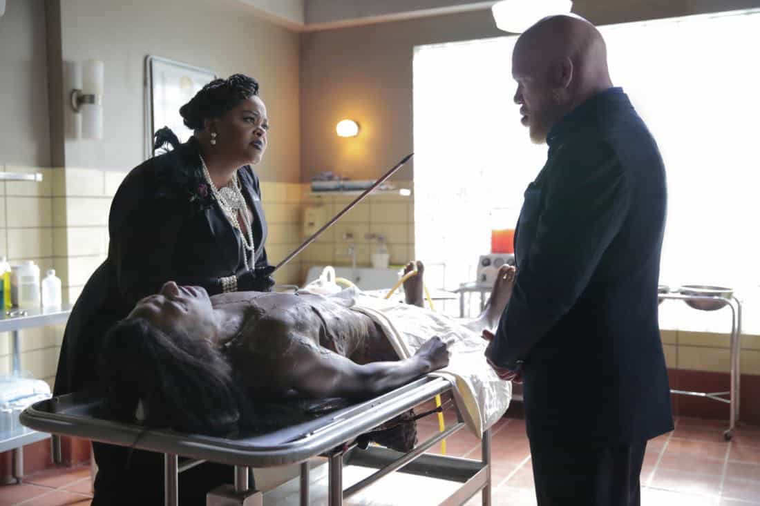 Black Lightning -- "Black Jesus" -- Image BLK104b_0351rb.jpg -- Pictured (L-R): Jill Scott as Lady Eve and Marvin "Krondon" Jones III as Tobias -- Photo: Carin Baer/The CW -- é 2018 The CW Network, LLC. All rights reserved. Black Lightning -- "Black Jesus" -- Image BLK104b_0351rb.jpg -- Pictured (L-R): Jill Scott as Lady Eve and Marvin "Krondon" Jones III as Tobias -- Photo: Carin Baer/The CW -- é 2018 The CW Network, LLC. All rights reserved.