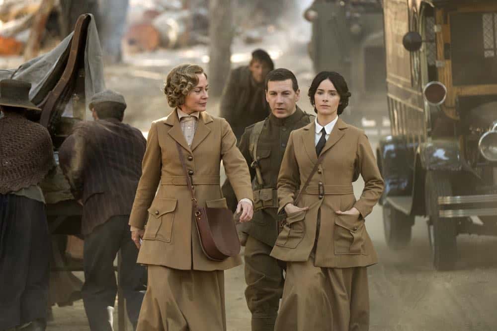 TIMELESS -- "The War to End All Wars" Episode 201 -- Pictured: (l-r) Susanna Thompson as Carol, Johnathan Stanley as Mac, Abigail Spencer as Lucy Preston -- (Photo by: Justin Lubin/NBC)