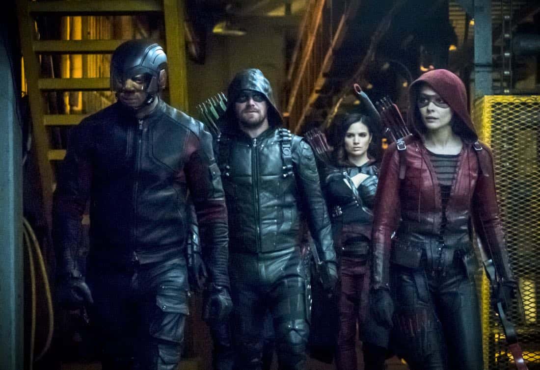 Arrow -- "The Thanatos Guild" -- Image Number: AR616b_0150.jpg -- Pictured (L-R): David Ramsey as John Diggle/Spartan, Stephen Amell as Oliver Queen/Green Arrow, Katrina Law as Nyssa Al-Ghul and Willa Holland as Thea Queen/Speedy -- Photo: Katie Yu/The CW -- é 2018 The CW Network, LLC. All rights reserved.