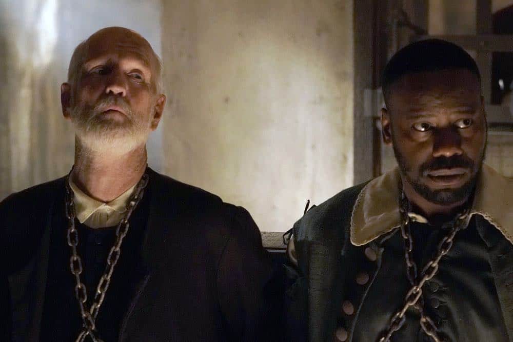 TIMELESS -- "The Salem Witch Hunt" Episode 204 -- Pictured: (l-r) David Wells as Prisoner/Wardwell Michael Barrett as Rufus Carlin -- (Photo by: Chris Haston/NBC)