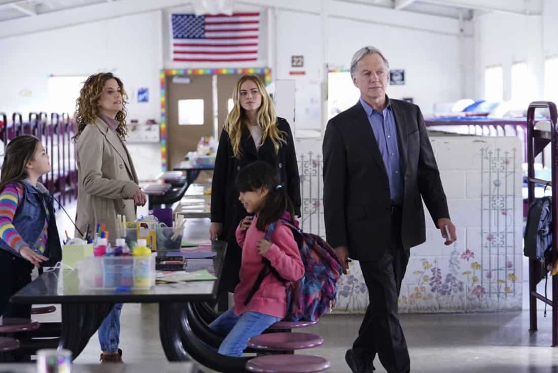"The Numerical Limit" -- Gibbs is granted protective custody of a 10-year-old orphaned refugee, Elena (Lily Rose Silver), when an NCIS case reveals she is the target of a violent gang, on NCIS, Tuesday, April 3 (8:00-9:00 PM, ET/PT) on the CBS Television Network. Pictured: Alexis Carra, Emily Wickersham, Mark Harmon Photo: Sonja Flemming/CBS é2018 CBS Broadcasting, Inc. All Rights Reserved