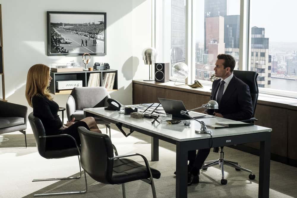 SUITS -- "Bad Man" Episode 712 -- Pictured: (l-r) Sarah Rafferty as Donna Paulsen, Gabriel Macht as Harvey Specter -- (Photo by: Christos Kalohoridis/USA Network)