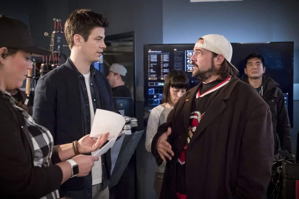 The Flash -- "Null and Annoyed" -- Image Number: FLA417a_BTS_0385.jpg -- Pictured (L-R): Behind the scenes with Grant Gustin and Kevin Smith -- Photo: Katie Yu/The CW -- é 2018 The CW Network, LLC. All rights reserved