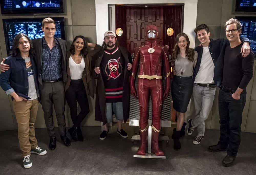 The Flash -- "Null and Annoyed" -- Image Number: FLA417a_BTS_0330b.jpg -- Pictured (L-R): Behind the scenes with Carlos Valdes, Hartley Sawyer, Candice Patton, Kevin Smith, Danielle Panabaker, Grant Gustin and Tom Cavanagh -- Photo: Katie Yu/The CW -- é 2018 The CW Network, LLC. All rights reserved