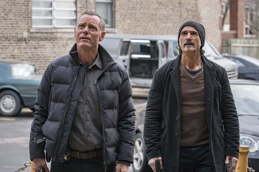 CHICAGO P.D. -- "Payback" Episode 519 -- Pictured: (l-r) Jason Beghe as Hank Voight, Elias Koteas as Alvin Olinsky -- (Photo by: Matt Dinerstein/NBC)