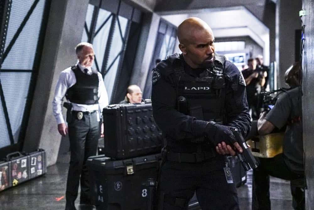 "Armory" -- As Hondo and SWAT work to de-escalate a hostage situation in which an ex-convict is holding a local family captive, the mission takes a dangerous turn that impacts the team. Also, when Street tires of his complicated romantic entanglements, he agrees to let Chris make over his online dating profile, on S.W.A.T., Thursday, April 12 (10:00-11:00 PM, ET/PT) on the CBS Television Network. Pictured L to R: Patrick St. Esprit as Robert Hicks and Shemar Moore as Daniel "Hondo" Harrelson. Photo: Sonja Flemming/CBS é2018 CBS Broadcasting, Inc. All Rights Reserved