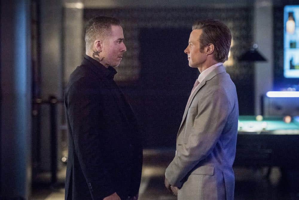 Arrow -- "The Dragon" -- Image Number: AR619a_0021.jpg -- Pictured (L-R): Kirk Acevedo as Ricardo Diaz and Ashton Holmes as Eric Cartier -- Photo: Dean Buscher/The CW -- é 2018 The CW Network, LLC. All rights reserved. Arrow -- "The Dragon" -- Image Number: AR619a_0021.jpg -- Pictured (L-R): Kirk Acevedo as Ricardo Diaz and Ashton Holmes as Eric Cartier -- Photo: Dean Buscher/The CW -- é 2018 The CW Network, LLC. All rights reserved.
