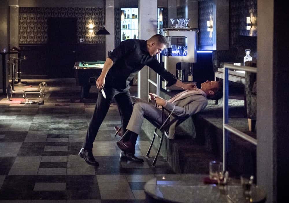 Arrow -- "The Dragon" -- Image Number: AR619a_0260.jpg -- Pictured (L-R): Kirk Acevedo as Ricardo Diaz and Ashton Holmes as Eric Cartier -- Photo: Dean Buscher/The CW -- é 2018 The CW Network, LLC. All rights reserved.