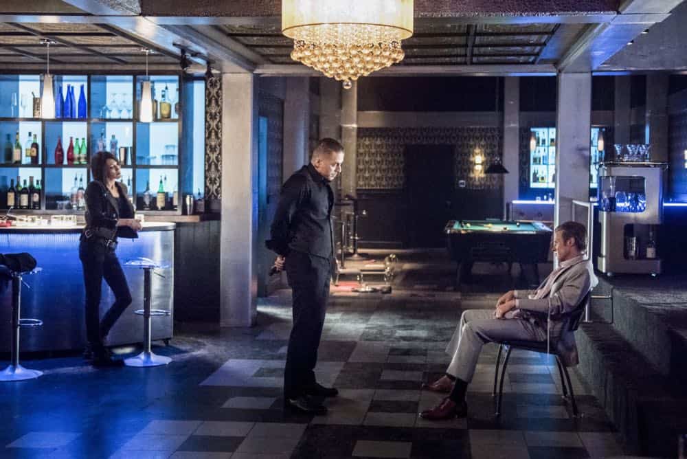Arrow -- "The Dragon" -- Image Number: AR619a_0272.jpg -- Pictured (L-R): Katie Cassidy as Laurel/Black Siren, Kirk Acevedo as Ricardo Diaz and Ashton Holmes as Eric Cartier -- Photo: Dean Buscher/The CW -- é 2018 The CW Network, LLC. All rights reserved.