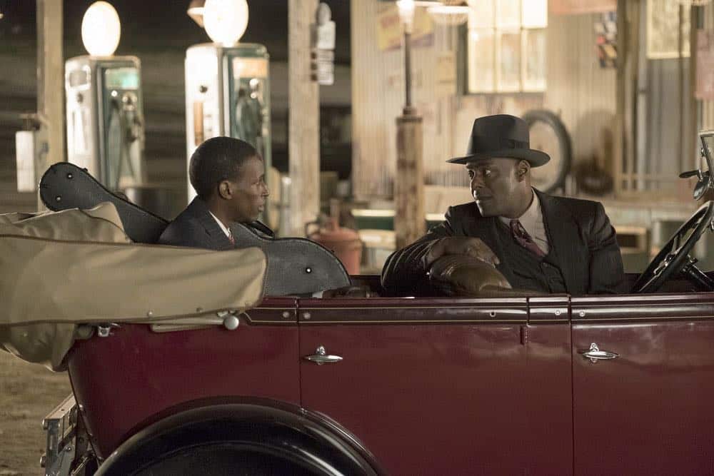 TIMELESS -- "King of Delta Blues" Episode 206 -- Pictured: (l-r) Kamal Naiqui as Robert Johnson, Paterson Joseph as Connor Mason -- (Photo by: Justin Lubin/NBC)