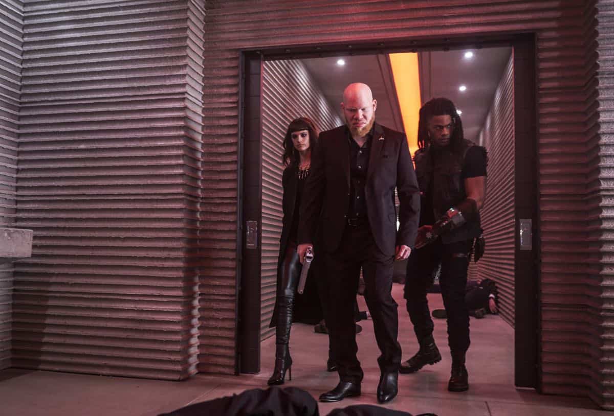Black Lightning -- " Shadow of Death: The Book of War" -- Image BLK113A_0240b.jpg àPictured (L-R): Charlbi Dean Kriek as Syonide, and Marvin "Krondon" Jones III as Tobias and Jordan Calloway as Khalil/Painkiller -- Photo: Bob Mahoney/The CW -- é 2018 The CW Network, LLC. All rights reserved