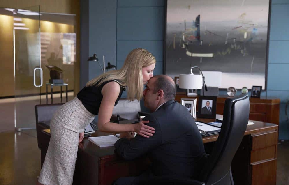SUITS -- "Pulling the Goalie" Episode 714 -- Pictured: (l-r) Amanda Schull as Katrina Bennett, Rick Hoffman as Louis Litt -- (Photo by: Shane Mahood/USA Network) SUITS -- "Pulling the Goalie" Episode 714 -- Pictured: (l-r) Amanda Schull as Katrina Bennett, Rick Hoffman as Louis Litt -- (Photo by: Shane Mahood/USA Network)