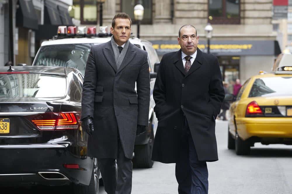 SUITS -- "Tiny Violin" Episode 715 -- Pictured: (l-r) Gabriel Macht as Harvey Specter, Rick Hoffman as Louis Litt -- (Photo by: Ian Watson/USA Network) SUITS -- "Tiny Violin" Episode 715 -- Pictured: (l-r) Gabriel Macht as Harvey Specter, Rick Hoffman as Louis Litt -- (Photo by: Ian Watson/USA Network)