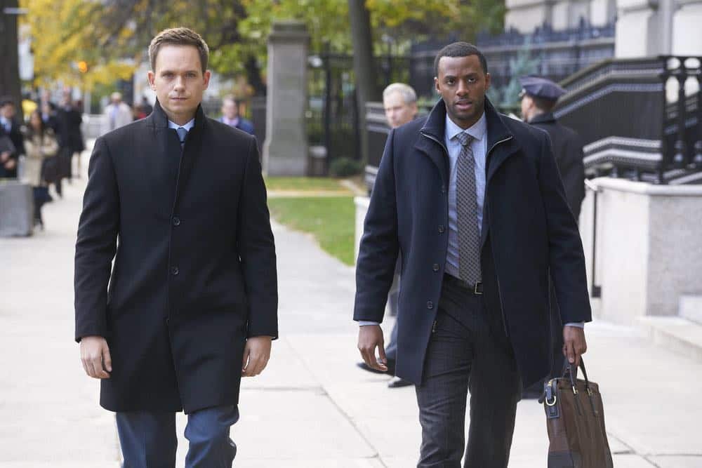 SUITS -- "Tiny Violin" Episode 715 -- Pictured: (l-r) Patrick J. Adams as Mike Ross, Jordan Johnson-Hinds as Oliver -- (Photo by: Ian Watson/USA Network)