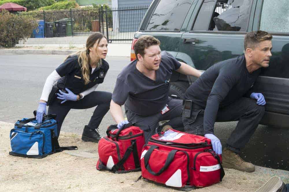"Third Year" -- A drug bust-turned-shootout tests the bravery of the doctors of Angels Memorial as they race to save a girl caught in the crossfire. Also, Willis (Rob Lowe) shifts his focus to field medicine, choosing to work primarily on an ambulance with his new partner, paramedic Rox (Moon Bloodgood). And Leanne (Marcia Gay Harden) begins her journey to adopt Ariel (Emily Alyn Lind), on the third season premiere of CODE BLACK, Wednesday, April 25 (10:00-11:00PM, ET/PT) on the CBS Television Network. Pictured: Moon Bloodgood (Rox Valenzuela), Harry Ford (Dr. Angus Leighton), Rob Lowe (Col. Ethan Willis) Photo: Monty Brinton/CBS é2017 CBS Broadcasting, Inc. All Rights Reserved