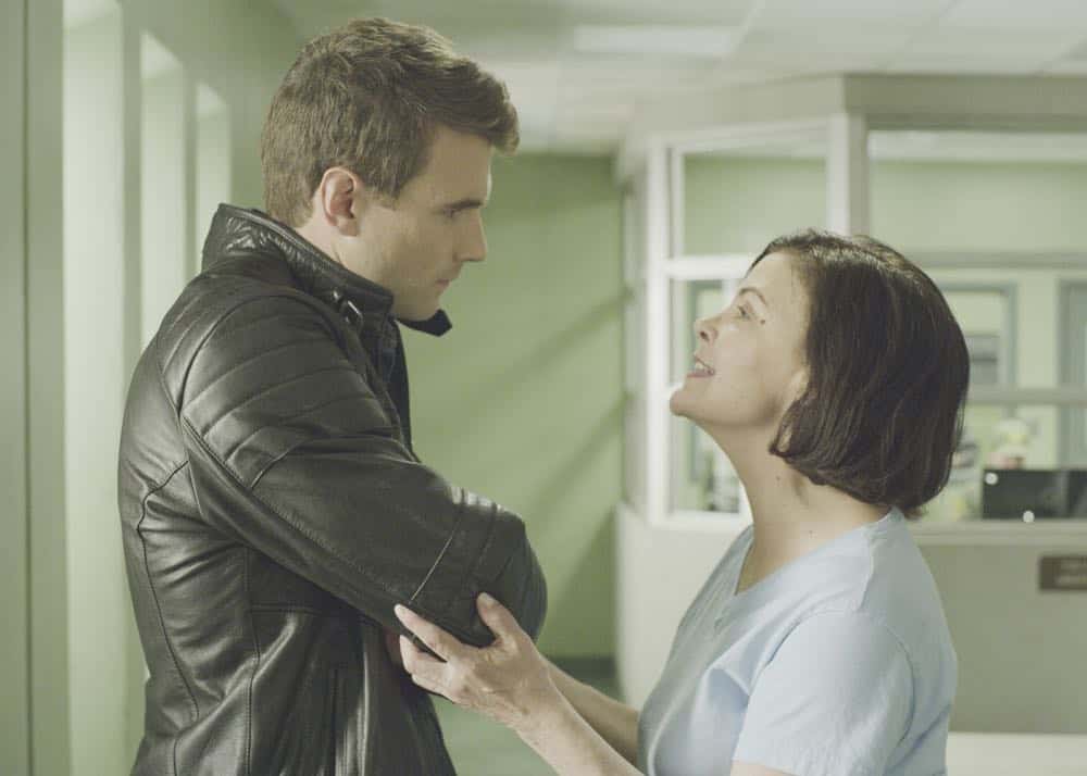 "Source" -- Jim Street debates whether or not his mother, Karen (Sherilyn Fenn), should live with him upon her prison release after Hondo and Chris warn him against it. Also, Hondo and the team are assigned to protect Irina Zemanova (Anya Monzikova), a high profile Russian journalist visiting Los Angeles, from being assassinated, on S.W.A.T., Thursday, April 26 (10:00-11:00, ET/PT) on the CBS Television Network. Pictured Left to right: Alex Russell as Jim Street and Sherilyn Fenn as Karen. Photo: Best Possible Screen Grab/CBS. é2018 CBS Broadcasting, Inc. All Rights Reserved
