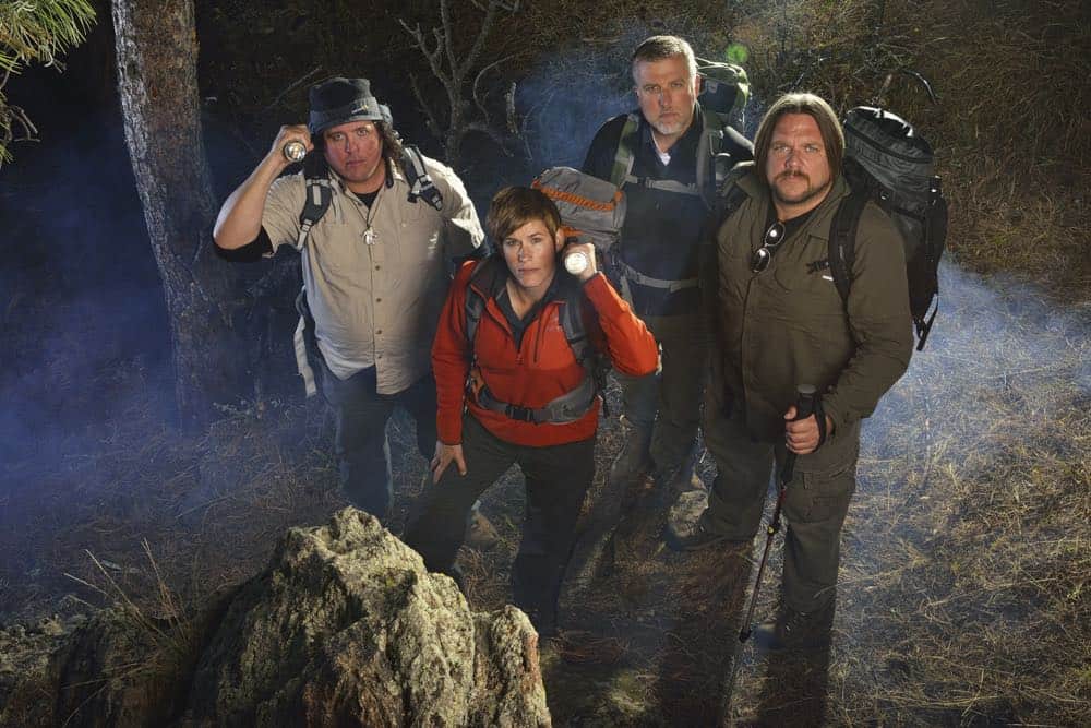 Matt Moneymaker, James 'Bobo' Fay, Cliff Barackman and Ranae Holland of Discovery's Finding Bigfoot in the woods of Colorado with flashlights and cameras.