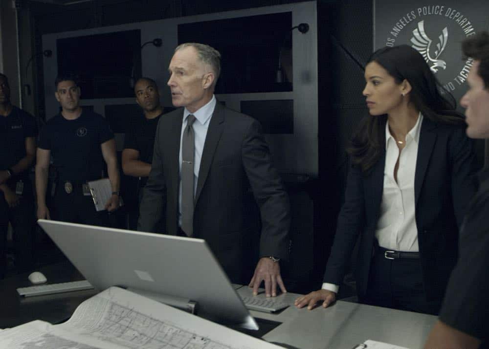 "Shaky Town" -- The SWAT team engages in a standoff with human traffickers holding child hostages when a major earthquake hits Los Angeles during their operation and compromises the takedown. Also, while Hondo forms an unexpected personal connection with Deputy District Attorney Nia Wells (Nikiva Dionne), Jim Street has trouble adjusting to his new life as a patrol officer, on the second season premiere of S.W.A.T., Thursday, Sept. 27 (10:00-11:00 PM, ET/PT) on the CBS Television Network. Pictured L to R: Patrick St. Esprit as Commander Robert Hicks and Stephanie Sigman as Jessica Cortez. Photo: Screengrab/CBS é2018 CBS Broadcasting, Inc. All Rights Reserved