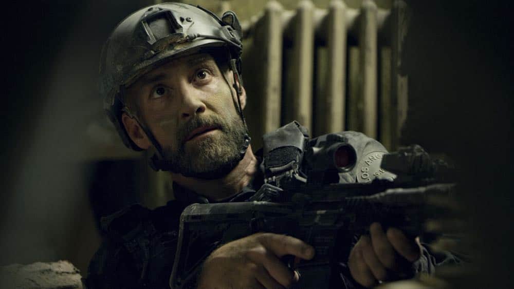 "Shaky Town" -- The SWAT team engages in a standoff with human traffickers holding child hostages when a major earthquake hits Los Angeles during their operation and compromises the takedown. Also, while Hondo forms an unexpected personal connection with Deputy District Attorney Nia Wells (Nikiva Dionne), Jim Street has trouble adjusting to his new life as a patrol officer, on the second season premiere of S.W.A.T., Thursday, Sept. 27 (10:00-11:00 PM, ET/PT) on the CBS Television Network. Pictured: Jay Harrington as David "Deacon" Kay. Photo: Screengrab/CBS é2018 CBS Broadcasting, Inc. All Rights Reserved