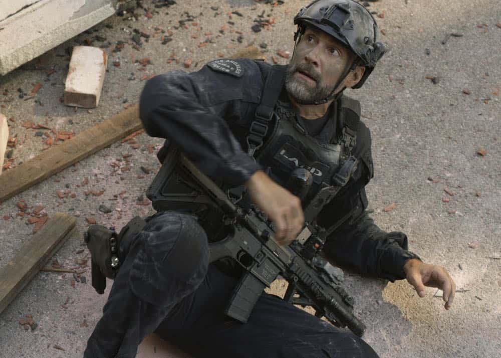 "Shaky Town" -- The SWAT team engages in a standoff with human traffickers holding child hostages when a major earthquake hits Los Angeles during their operation and compromises the takedown. Also, while Hondo forms an unexpected personal connection with Deputy District Attorney Nia Wells (Nikiva Dionne), Jim Street has trouble adjusting to his new life as a patrol officer, on the second season premiere of S.W.A.T., Thursday, Sept. 27 (10:00-11:00 PM, ET/PT) on the CBS Television Network. Pictured: Jay Harrington as David "Deacon" Kay. Photo: Screengrab/CBS é2018 CBS Broadcasting, Inc. All Rights Reserved