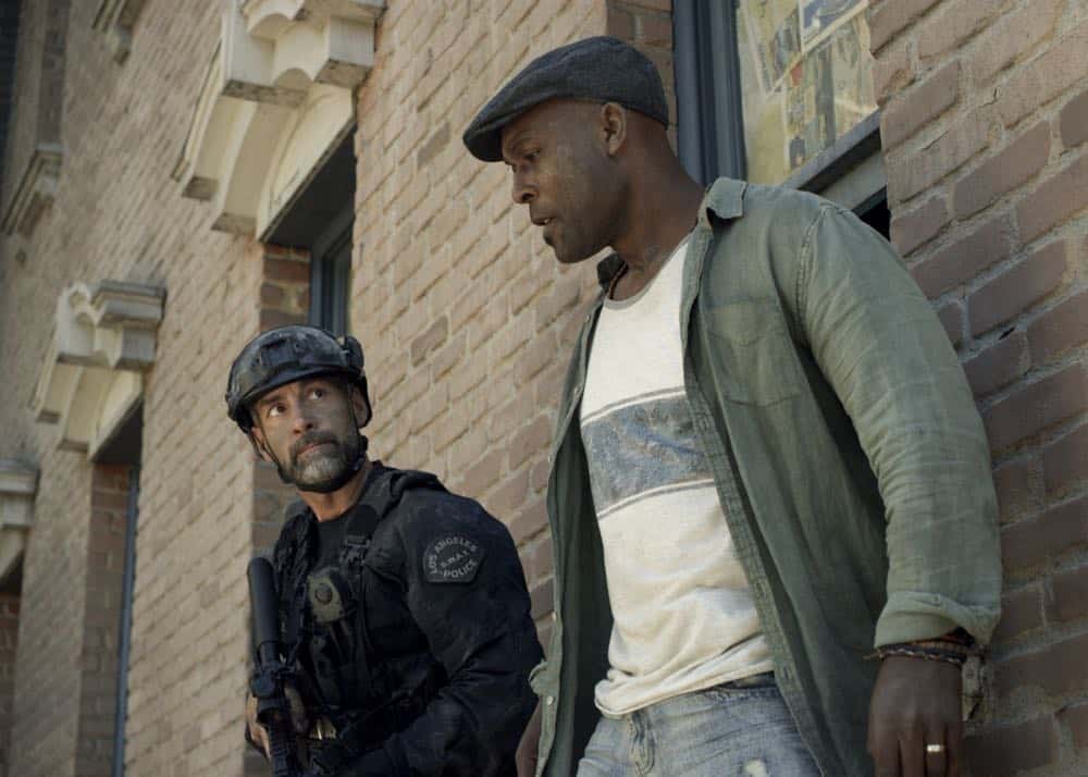 "Shaky Town" -- The SWAT team engages in a standoff with human traffickers holding child hostages when a major earthquake hits Los Angeles during their operation and compromises the takedown. Also, while Hondo forms an unexpected personal connection with Deputy District Attorney Nia Wells (Nikiva Dionne), Jim Street has trouble adjusting to his new life as a patrol officer, on the second season premiere of S.W.A.T., Thursday, Sept. 27 (10:00-11:00 PM, ET/PT) on the CBS Television Network. Pictured: Jay Harrington as David "Deacon" Kay and E.R. Ruiz as Jax. Photo: Screengrab/CBS é2018 CBS Broadcasting, Inc. All Rights Reserved
