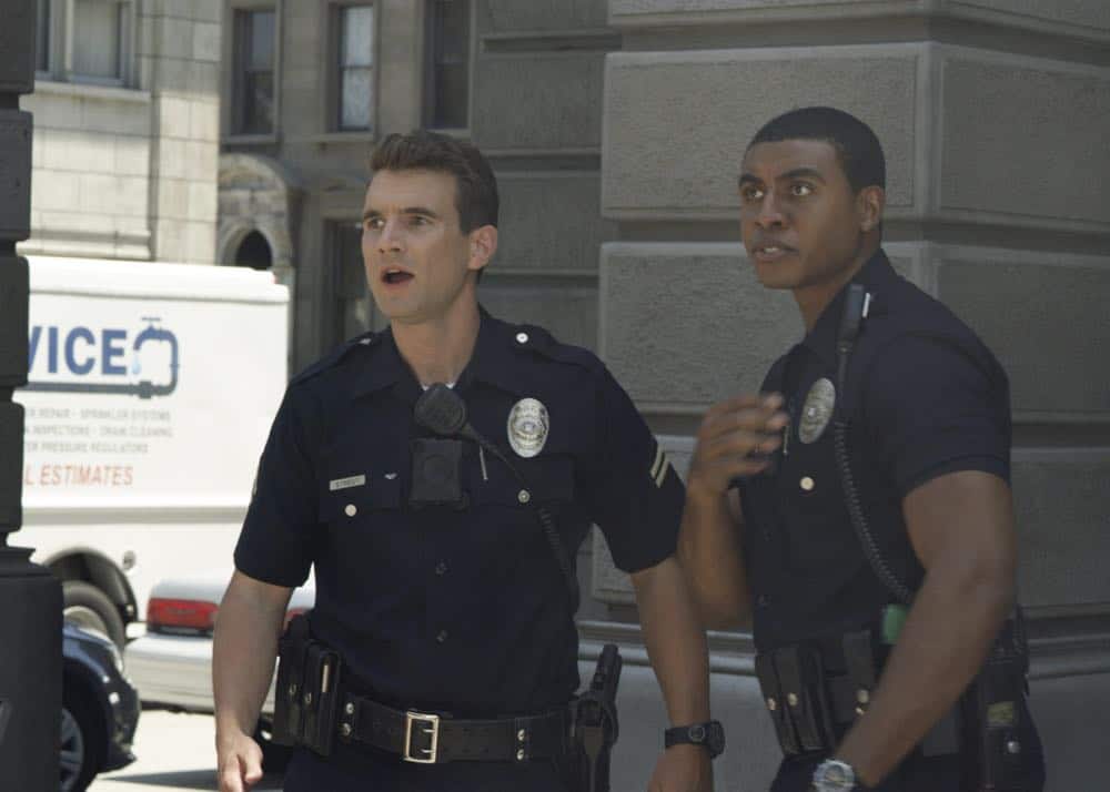 "Shaky Town" -- The SWAT team engages in a standoff with human traffickers holding child hostages when a major earthquake hits Los Angeles during their operation and compromises the takedown. Also, while Hondo forms an unexpected personal connection with Deputy District Attorney Nia Wells (Nikiva Dionne), Jim Street has trouble adjusting to his new life as a patrol officer, on the second season premiere of S.W.A.T., Thursday, Sept. 27 (10:00-11:00 PM, ET/PT) on the CBS Television Network. Pictured L to R: Alex Russell as Jim Street and Joseph Lee Anderson as Tony. Photo: Screengrab/CBS é2018 CBS Broadcasting, Inc. All Rights Reserved