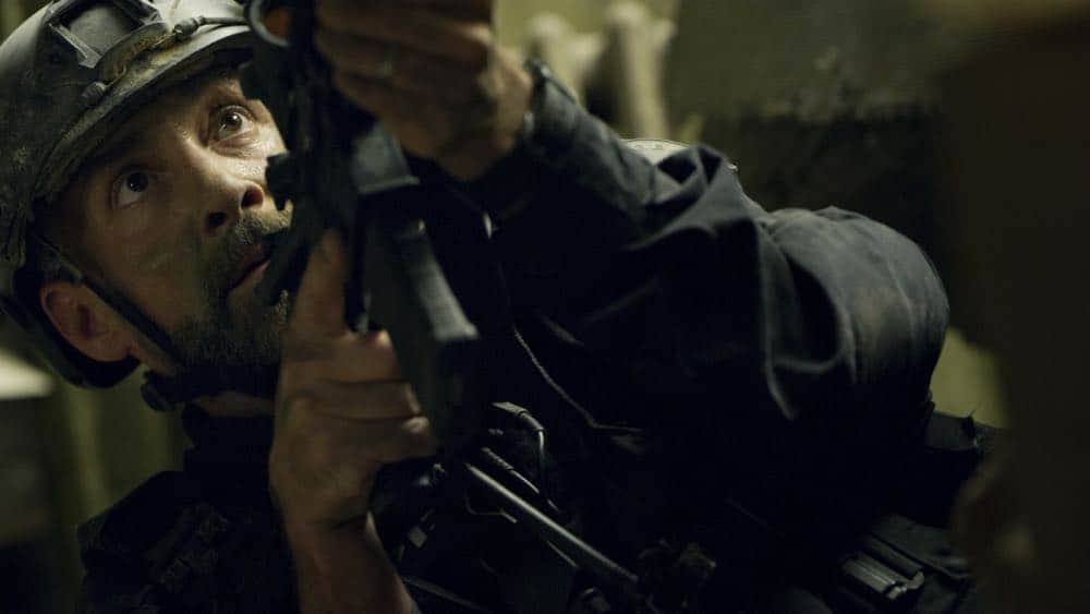 "Shaky Town" -- The SWAT team engages in a standoff with human traffickers holding child hostages when a major earthquake hits Los Angeles during their operation and compromises the takedown. Also, while Hondo forms an unexpected personal connection with Deputy District Attorney Nia Wells (Nikiva Dionne), Jim Street has trouble adjusting to his new life as a patrol officer, on the second season premiere of S.W.A.T., Thursday, Sept. 27 (10:00-11:00 PM, ET/PT) on the CBS Television Network. Pictured: Jay Harrington as David "Deacon" Kay. Photo: Screengrab/CBS é2018 CBS Broadcasting, Inc. All Rights Reserved