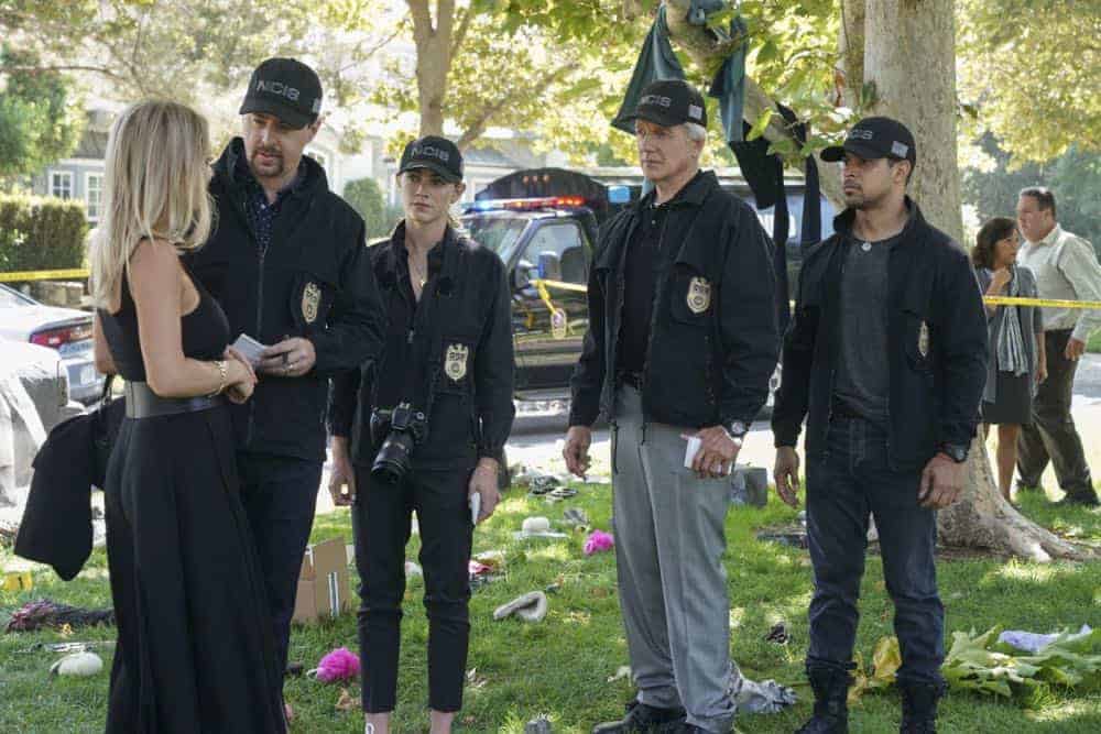 "Boom" -- One of the NCIS agents is starstruck after the team investigates an explosion outside the home of Navy Petty Officer First Class Todd Nicholas (Cameron Radice) and his wife, popular reality TV star Sheba Nicholas (Tara Holt). Also, Vance continues physical therapy for the injuries sustained when he was held hostage, on NCIS, Tuesday, Oct. 9 (8:00-9:00 PM, ET/PT) on the CBS Television Network. Pictured: Tara Holt, Sean Murray, Emily Wickersham, Mark Harmon, Wilmer Valderrama. Photo: Sonja Flemming/CBS é2018 CBS Broadcasting, Inc. All Rights Reserved