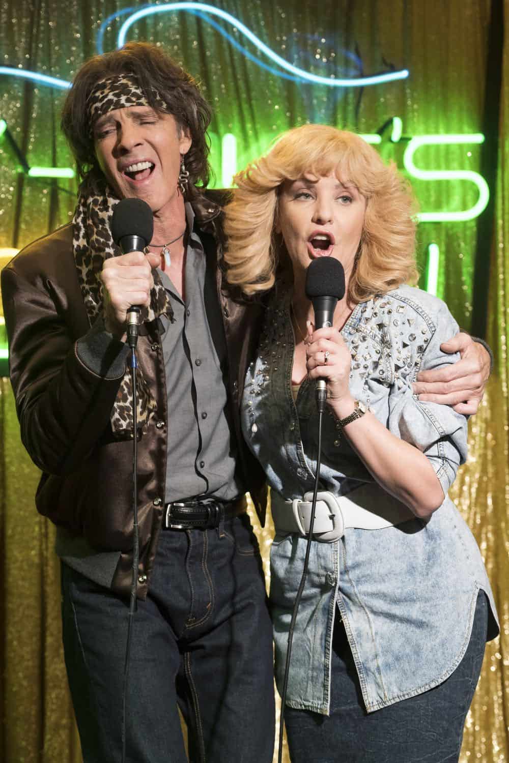 THE GOLDBERGS - "RAD!" - Erica thinks all of her singing dreams are going to come true when she lands a job at the new karaoke bar in town. But when she's tasked with bringing in more customers, will Erica regret turning to Beverly for help? Meanwhile, Murray tries to teach Barry and Lainey how to be financially responsible adults, on "The Goldbergs," WEDNESDAY, OCT. 10 (8:00-8:30 p.m. EDT), on The ABC Television Network. (ABC/Ron Tom) RICK SPRINGFIELD, WENDI MCLENDON-COVEY