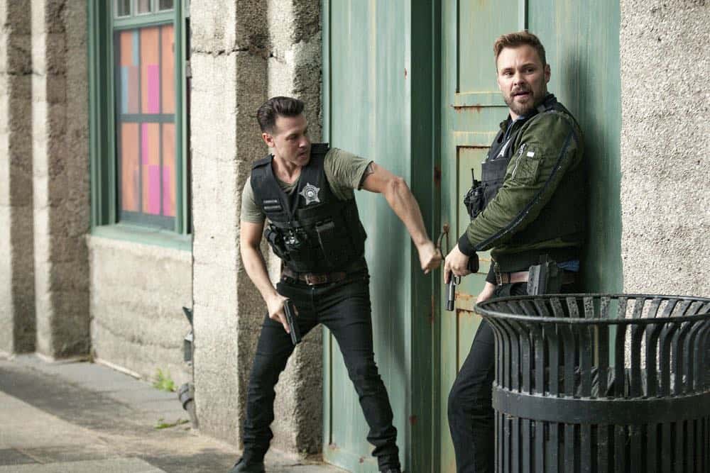 CHICAGO P.D. -- "Bad Boys" Episode 603 -- Pictured: (l-r) Jon Seda as Antonio Dawson, Patrick John Flueger as Adam Ruzek -- (Photo by: Matt Dinerstein/NBC)