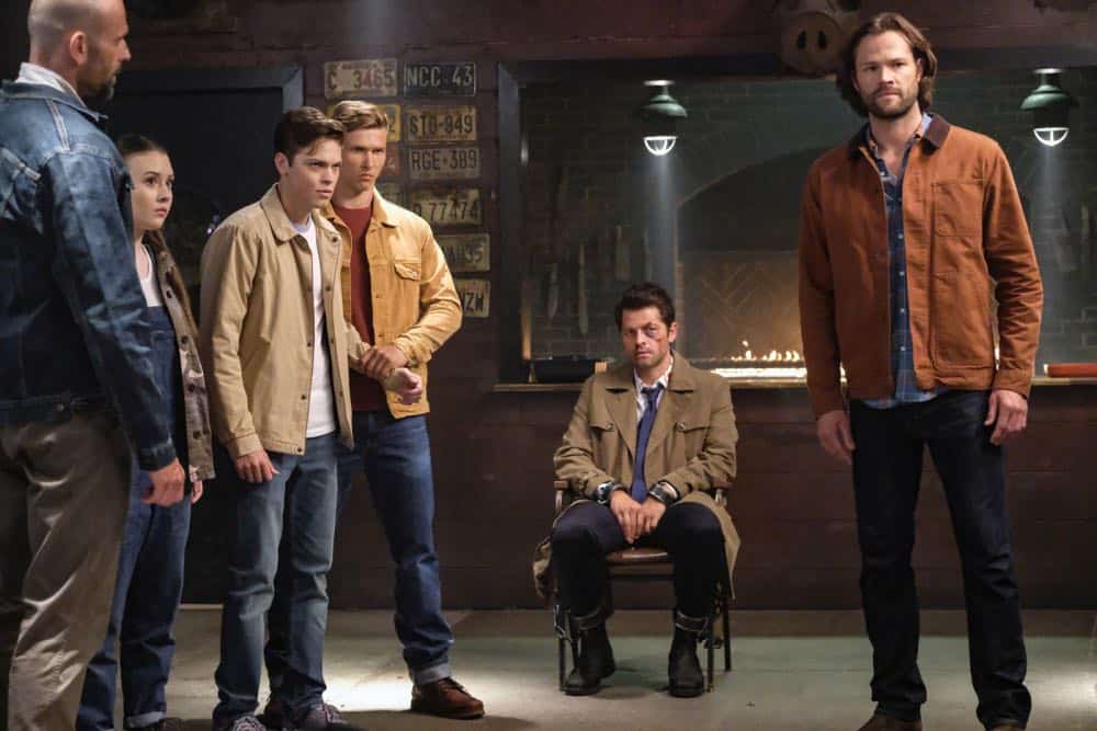 Supernatural -- "Stranger in a Strange Land" -- Image Number: SN1401b_0091b.jpg -- Pictured (L-R): Katherine Evans as Maggie, Alexander Calvert as Jack, Misha Collins as Castiel and Jared Padalecki as Sam -- Photo: Bettina Strauss/The CW -- é 2018 The CW Network, LLC All Rights Reserved