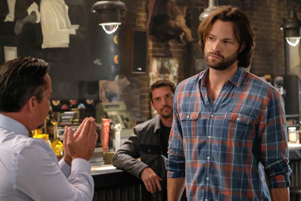 Supernatural -- "Stranger in a Strange Land" -- Image Number: SN1401b_0293b.jpg -- Pictured (L-R): Dean Armstrong as Kip and Jared Padalecki as Sam -- Photo: Bettina Strauss/The CW -- é 2018 The CW Network, LLC All Rights Reserved Supernatural -- "Stranger in a Strange Land" -- Image Number: SN1401b_0293b.jpg -- Pictured (L-R): Dean Armstrong as Kip and Jared Padalecki as Sam -- Photo: Bettina Strauss/The CW -- é 2018 The CW Network, LLC All Rights Reserved