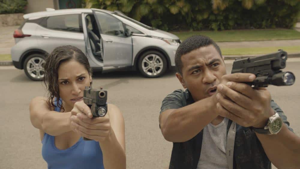 "Mimiki ke kai, ahuwale ka papa leho" -- Crime spikes when a heat wave hits Oahu, causing McGarrett and Danny to hunt down a bank thief, and Tani and Junior's car is stolen while they're on duty. Also, Grover plays the golf game of a lifetime, and Kamekona incites a riot by price-gouging on his shave ice, on HAWAII FIVE-0, Friday, Oct. 12 (9:00-10:00 PM, ET/PT) on the CBS Television Network. Pictured L to R: Meaghan Rath as Tani Rey and Beulah Koale as Junior Reigns. Photo: Screengrab/CBS é2018 CBS Broadcasting, Inc. All Rights Reserved ("Mimiki ke kai, ahuwale ka papa leho" is Hawaiian for "When the Sea Draws Out the Tidal Wave, the Rocks Where the Cowries Hide Are Exposed")