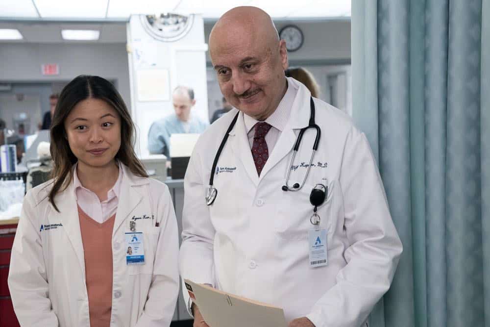 NEW AMSTERDAM -- "Boundaries" Episode 104 -- Pictured: (l-r) Christine Chang as Agnes Kao, Anupam Kher as Dr. Vijay Kapoor -- (Photo by: Virginia Sherwood/NBC)