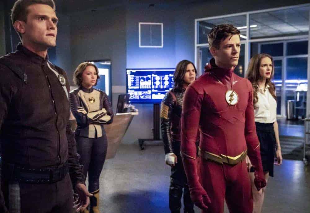 The Flash -- "Blocked" -- Image Number: FLA502a_0108b2b.jpg -- Pictured (L-R): Hartley Sawyer as Dibney/Elongated Man, Jessica Parker Kennedy as Nora West - Allen/XS, Carlos Valdes as Cisco Ramon/Vibe, Grant Gustin as Barry Allen/ The Flash and Danielle Panabaker as Caitlin Snow -- Photo: Jack Rowand/The CW -- é 2018 The CW Network, LLC. All rights reserved The Flash -- "Blocked" -- Image Number: FLA502a_0108b2b.jpg -- Pictured (L-R): Hartley Sawyer as Dibney/Elongated Man, Jessica Parker Kennedy as Nora West - Allen/XS, Carlos Valdes as Cisco Ramon/Vibe, Grant Gustin as Barry Allen/ The Flash and Danielle Panabaker as Caitlin Snow -- Photo: Jack Rowand/The CW -- é 2018 The CW Network, LLC. All rights reserved